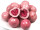 Schale mit gefriergetrockneten Bio Himbeeren umhüllt von rosafarbener Schokolade