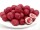Bio Erdbeeren in Zitronenschokolade – rosa Schokokugeln auf weißem Teller, aufgeschnitten mit Erdbeerkern und weißer Schokolade